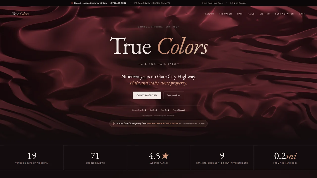 The True Colors salon home page on desktop: the wordmark over a deep red WebGL satin hero, the salon’s hours and phone number, and a stat band reading nineteen years, seventy-one Google reviews and a 4.5 average.